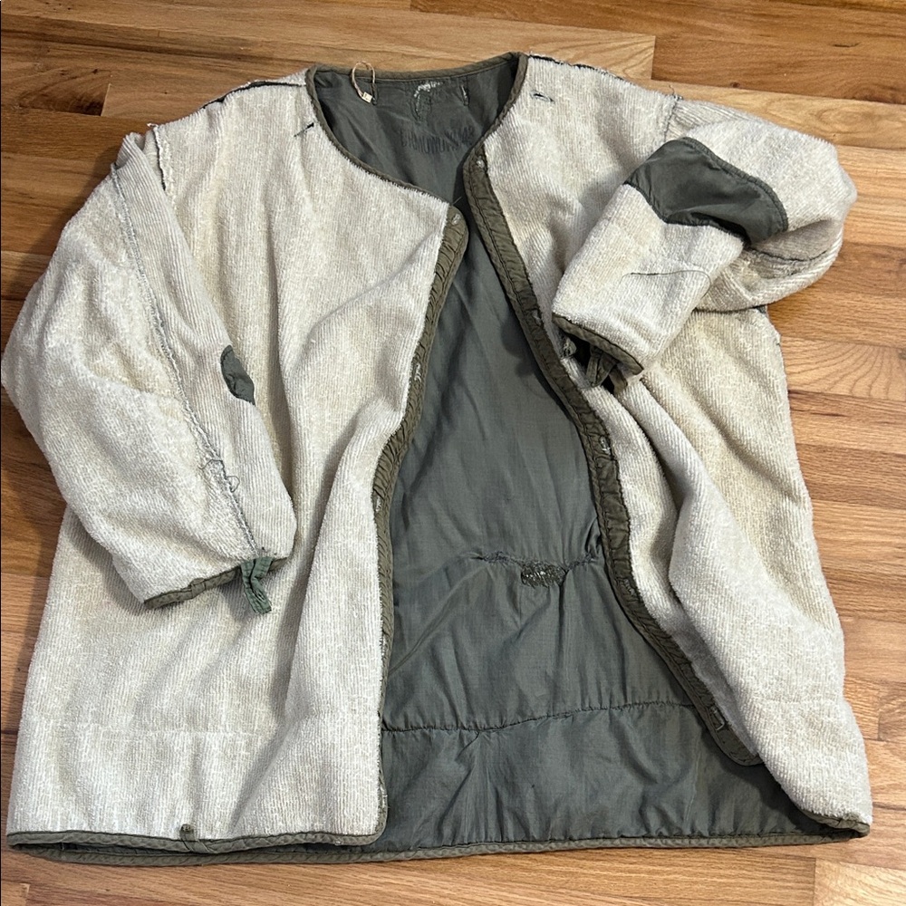 Vintage military jacket with many imperfections
